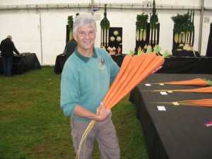John Trim FNVS with prize winning carrots