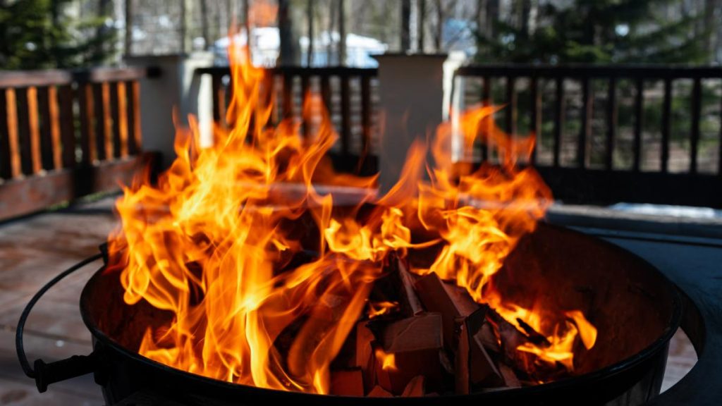 Barbecue grill with fire on open air close up photo